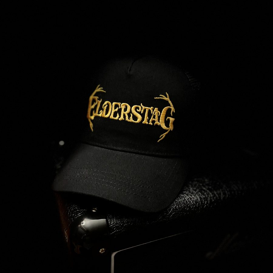 Black Elderstag trucker cap with the gold antler logo embroidered on the front