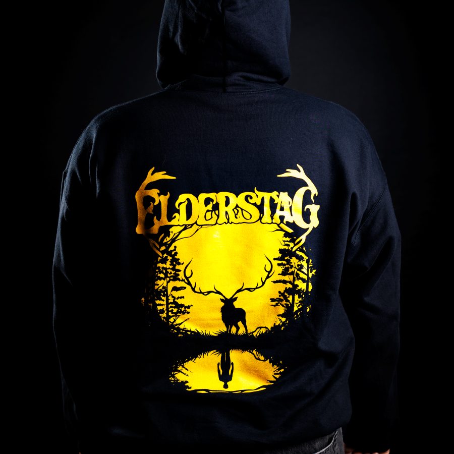 Back of a black Elderstag hoodie with a large gold print of the antler logo and the stag in the forest